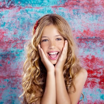 Blond kid girl happy smiling expression hands in face gesture