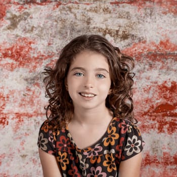 Bunette kid girl portrait smiling in retro vintage color
