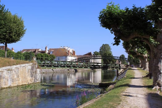 a river flowing into the canal Briare to Montargis with its rainbow bridge rainbow
