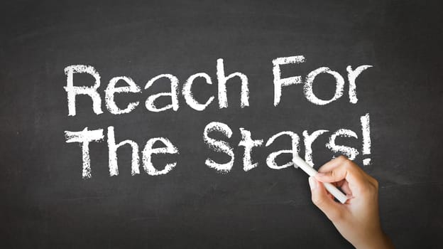 A person drawing and pointing at a Reach for the stars Chalk Illustration