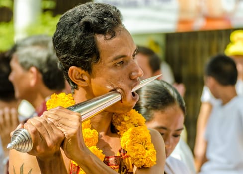 Phuket Vegeterian Festival. Shocking asian tradition - body piercing.