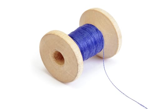 Spool of thread on white background