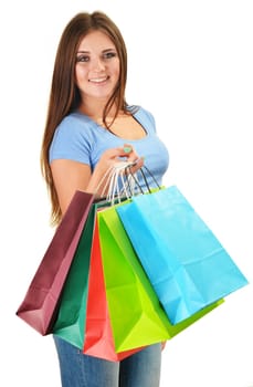 Young happy woman with colorful paper shopping bags isolated on white
