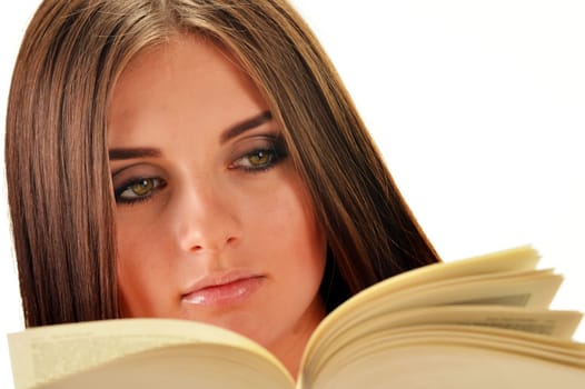 Young woman reading a book. Female student learning
