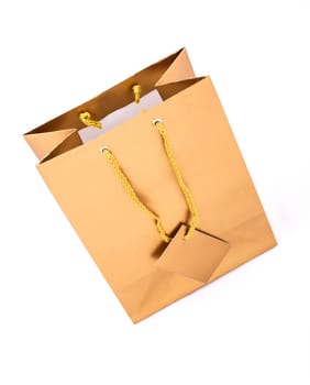 A gold gift bag isolated.