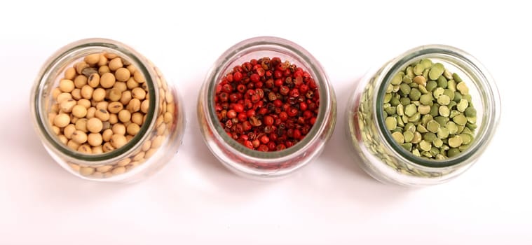 Variety of spices in a glass pot..
