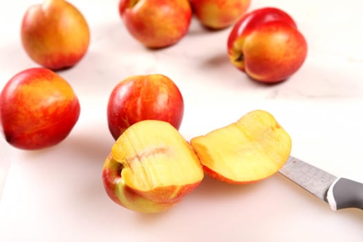 Cutting Nectarines on the kitchen table .