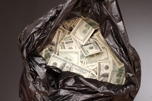 A Rubbish bag full of dollars .