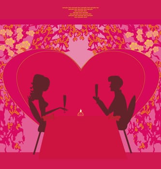 Young couple flirt and drink champagne