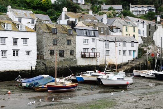 boats at low tide at Polperro in Cornwall