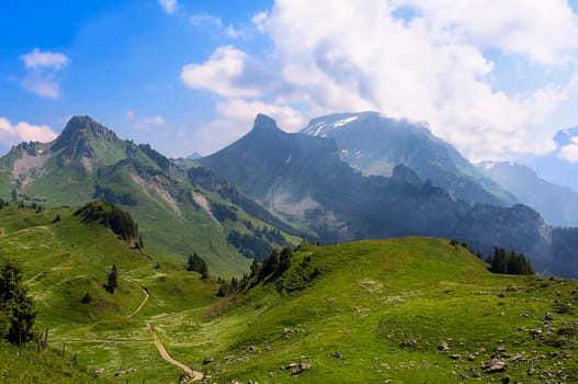 Alpine landscape with moving clouds