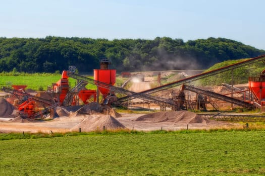 Photograph of a gravel pit with conveyor belts