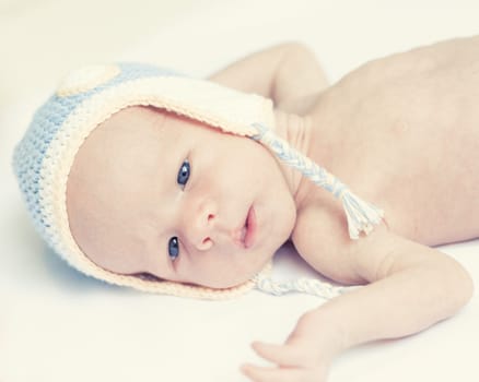 Cute beautiful baby is wearing a funny hat