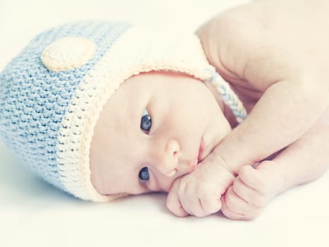 Cute beautiful baby is wearing a funny hat