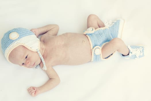 Cute beautiful baby is wearing a funny hat