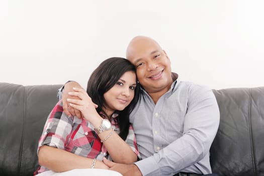 Portrait of smiling young couple at home