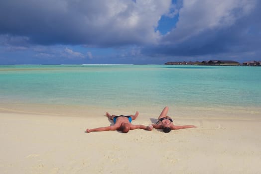 happy young  couple at summer vacation have fun and relax at beautiful sunny  day on beach