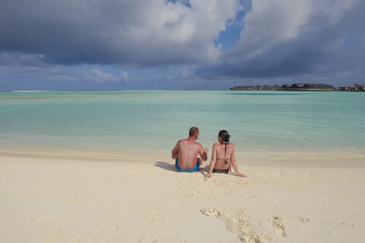 happy young  couple at summer vacation have fun and relax at beautiful sunny  day on beach