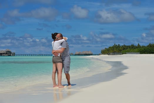 happy young  couple at summer vacation have fun and relax at beautiful sunny  day on beach