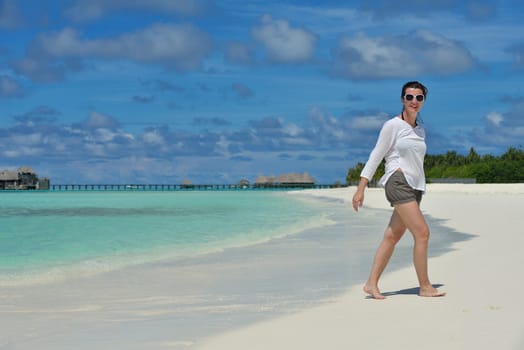 happy young  couple at summer vacation have fun and relax at beautiful sunny  day on beach