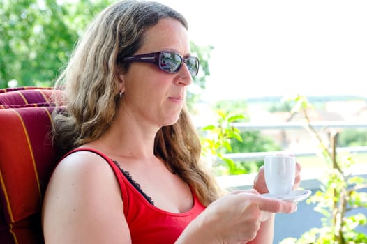 woman is drinking espresso