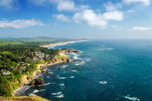 Lush green Oregon coast with beautiful blue Pacific Ocean