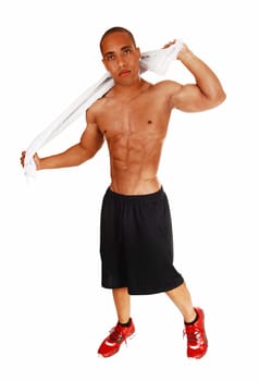A young muscular man after his exercise rubbing himself dry with a .white towel for white background..