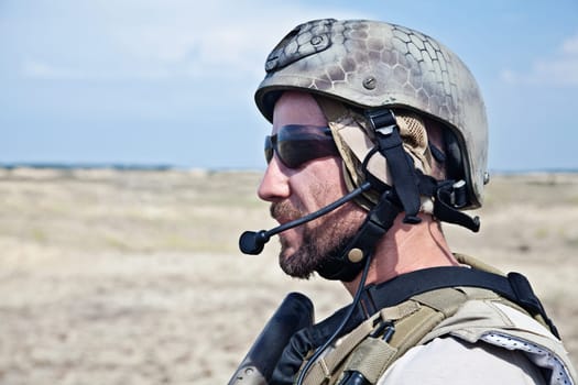 Bearded SEAL team member in the desert