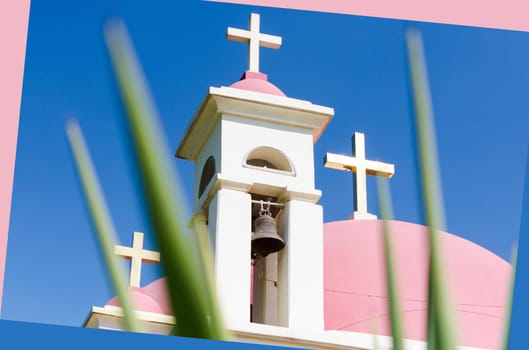 Pink domes and golden crosses on Greek Orthodox Church of the Seven Apostles in Capernaum
