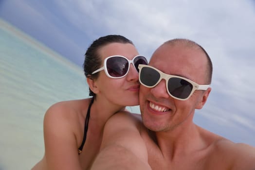 happy young  couple at summer vacation have fun and relax at beautiful sunny  day on beach
