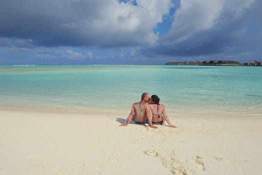 happy young  couple at summer vacation have fun and relax at beautiful sunny  day on beach