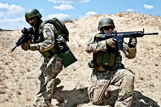 Two soldiers in the desert during the military operation