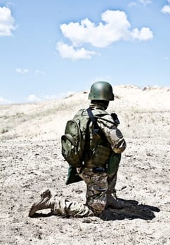 Soldier in the desert during the military operation