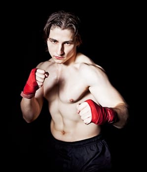 Young caucasian man preparing for boxing match