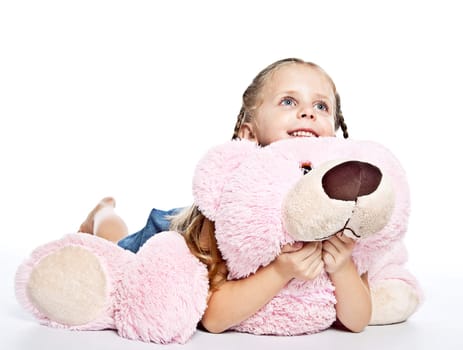 pretty little girl with plushies on white background