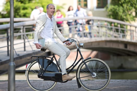 Man with tablet PC on bike