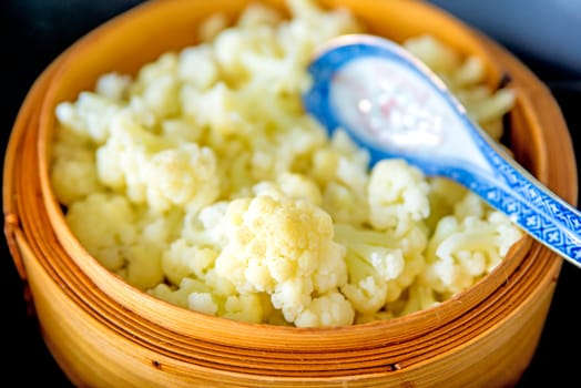 Chinese bamboo steam pot with cauliflower