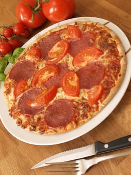 Pizza on a wooden background