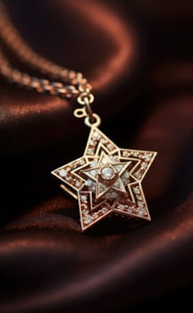 Golden star pendant with diamonds on a satin background