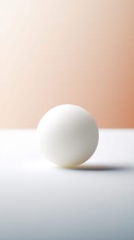 An egg on a table in front of a white background