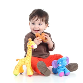 Pretty little baby girl playing with animal toys isolated on a white background