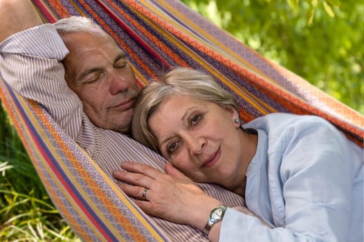 Closeup of senior Caucasian couple in hammock