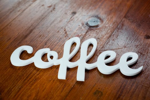 Coffee Sign on Wooden Table.