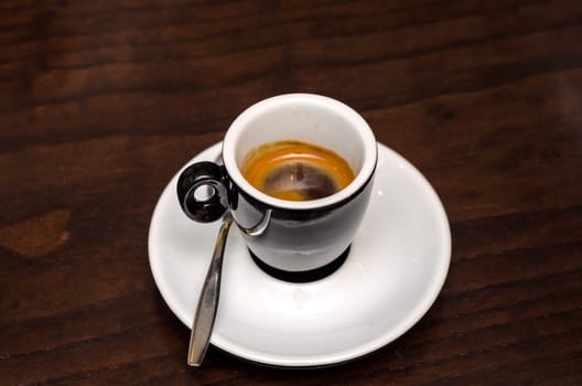 with black coffee cup and spoon