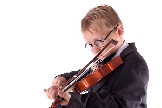 little boy enjoys playing the violin