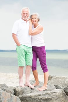 Active senior couple on the beach