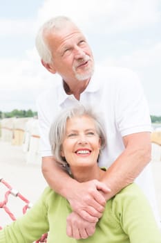 Happy senior couple on the beach