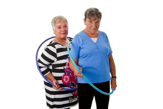 Two seniors with Hula Hoop - exposed on white background
