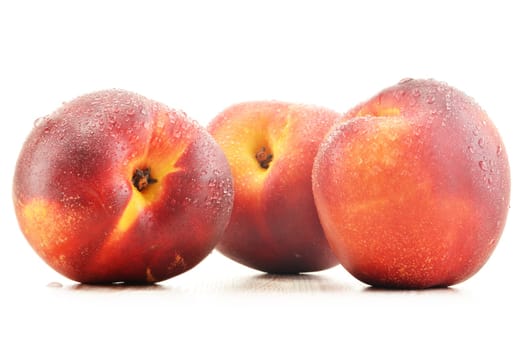 Three fresh nectarines isolated on white background