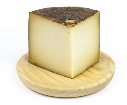 manchego cheese, typical of Spain, isolated on a white background